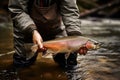 Fisherman With Trout Catch Royalty Free Stock Photo