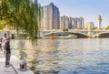 Fisherman under the tree at the river Haihe in Tianjin Royalty Free Stock Photo