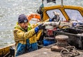 Fisherman unloading catch