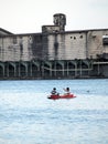 The fisherman use the the traditional boat and fishnet going to catch the fish