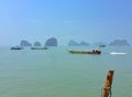 "Koh Tapoo, Ao Phang Nga" on island in Thailand. Many boat at sea and rock background. Royalty Free Stock Photo