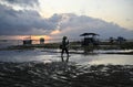 Fisherman Wades to his Boat at Dawn, Bali Indonesia