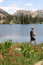 Fisherman walking by lakeside