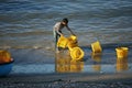 Fisherman wash plastic basket on beach