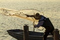 A fisherman casting a fishing net Royalty Free Stock Photo