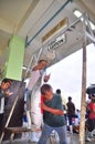 Fisherman is weighing tuna to sell to the market Royalty Free Stock Photo