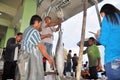 Fisherman is weighing tuna to sell to the market Royalty Free Stock Photo