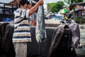 Fisherman weighs caught fish for sale at the fish market Royalty Free Stock Photo