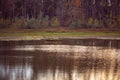 Fisherman in wooden boat catching fish on the lake, fishing Royalty Free Stock Photo