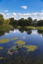 Fisherman on a wooden boat on the river Royalty Free Stock Photo