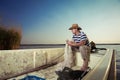 Fisherman at work, cleaning the nets