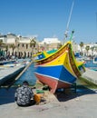 Fisherman Working on his Luzzu, Marsaxlokk