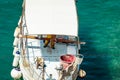 The fisherman working on white fishing boat and fish in the Mediterranean sea port Royalty Free Stock Photo