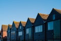 Fishermans huts style lodges near Whitable Harbour. They have the distictive black shiplap facades