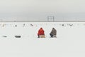 Fishermans on ice. Mans fishing on ice on gulf on Finland near Kronshtadt, Saint Petersburg, Russia, 03 February 2018