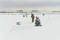 Fishermans on ice. Mans fishing on ice on gulf on Finland near Kronshtadt, Saint Petersburg, Russia, 03 February 2018