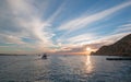 Fishermans sunrise view of fishing boats going out for the day past Lands End in Cabo San Lucas in Baja California Mexico Royalty Free Stock Photo