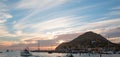 Fishermans sunrise view of fishing boats going out for the day past Lands End in Cabo San Lucas in Baja California Mexico Royalty Free Stock Photo