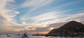 Fishermans sunrise view of fishing boats going out for the day past Lands End in Cabo San Lucas in Baja California Mexico Royalty Free Stock Photo