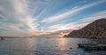 Fishermans sunrise view of fishing boats going out for the day past Lands End in Cabo San Lucas in Baja California Mexico Royalty Free Stock Photo