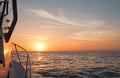 Fishermans view of pink yellow orange sunrise over the Sea of Cortes / Gulf of California while fishing in the early morning