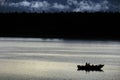 Fishermen in a Boat on a Lake or the Sea at Night