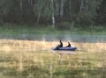 Fishermen on a boat on the lake