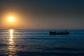 Fishermen boat at sunrise Black Sea Romania Royalty Free Stock Photo