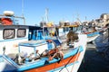 Fishermen boats anchored in harbor by fortress Koules Royalty Free Stock Photo