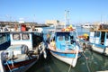 Fishermen boats anchored in harbor by fortress Koules Royalty Free Stock Photo