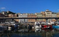 Fishermen boats moored in the dock area inside the ancient port of Genoa. Royalty Free Stock Photo