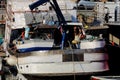 Fishermen boats moored in the dock area inside the ancient port of Genoa. Royalty Free Stock Photo