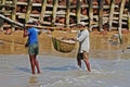 Fishermen carry boxes full of fishes at Digha, India