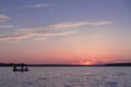 Fishermen catch fish on the background of a beautiful sunset Royalty Free Stock Photo