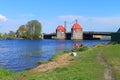 Fishermen catch fish in the river Deyma at the movable bridge `Eagle` Royalty Free Stock Photo