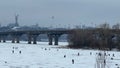 Fishermen catch fish during winter fishing in cloudy weather