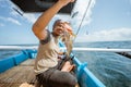 Fishermen catch grouper fish in the sea while fishing Royalty Free Stock Photo