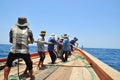 Fishermen are catching tuna with a trawl net.