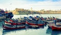 Fishermen check the net in the bay of El Jadida port