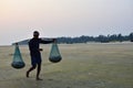 The fishermen collecting fishes and take it towards home in the evening at Baguran Jalpai sea beach near Digha