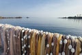 Fishermen colorful nets in front of calm sea water and clear sky. Seaside landscape, wallpaper Royalty Free Stock Photo