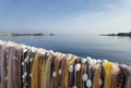 Fishermen colorful nets in front of calm sea water and clear sky. Seaside landscape, wallpaper