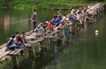 Fishermen crowd the bridge Royalty Free Stock Photo