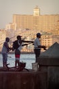 Fishermen at dawn on the famous Malecon seawall in Havana Royalty Free Stock Photo