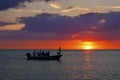 Fishermen and dog on a boat at sunset - Florida