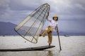 Fishermen with fish in Lake inle - traditional fishing on boat, Myanmar Royalty Free Stock Photo