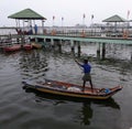 Fishermen fishing in back water