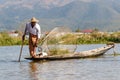Traditional Burmese fisherman at Inle lake, Myanmar famous for their distinctive one legged rowing style Royalty Free Stock Photo