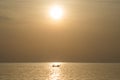 Fishermen fishing on a boat silhouette in morning sunrise light. Royalty Free Stock Photo