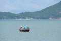 Fishermen fishing on a boat in Waterfall Bay, Hong Kong Royalty Free Stock Photo